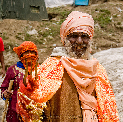 hindu devotee with trident - amarnath yatra (pilgrimage) - kashmir, amarnath yatra, baba, beard, bhagwa, headwear, hindu holy man, hindu man, hindu pilgrimage, hinduism, kashmir, mountain trail, mountains, old man, pilgrim, sadhu, saffron color, trident