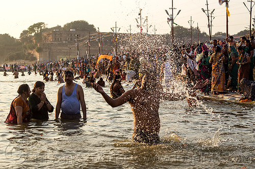 hindu devotees having holy dip in ganges river - splashing water (india), crowd, droplets, ganga, ganges river, hindu pilgrimage, hinduism, holy bath, holy dip, india, maha kumbh mela, nadi bath, river bank, river bathing, splash, splashing, triveni sangam