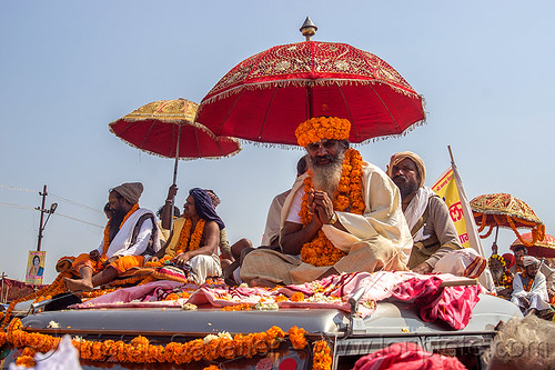 hindu guru on the roof of his decorated jeep - kumbh mela (india), float, gurus, hindu pilgrimage, hinduism, india, kumbh maha snan, maha kumbh mela, mauni amavasya, men, parade, umbrellas