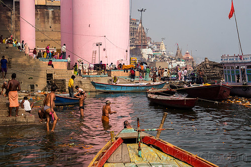 hindu holy bath in the ganges river - ghats of varanasi (india), bathing pilgrims, ganga, ganges river, ghats, hindu, hinduism, holy bath, holy dip, mooring, nadi bath, pink tower, river bathing, river boats, varanasi, water tower