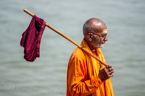 hindu man drying underpants on stick - varanasi (india), baba, bhagwa, cane, drying, finger rings, ganga, ganges river, hindu man, hinduism, purple, saffron color, tilak, tilaka, underpants, underware, varanasi