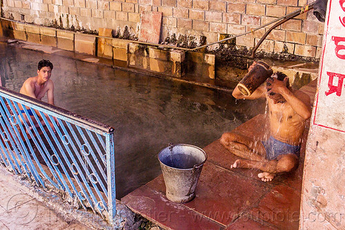 hindu pilgrims bathing at the surya kund pool - yamunotri sacred hot springs (india), bath, bathing, cross-legged, divya shila, hot springs, men, metal bucket, pool, pucket, shower, showering, sitting, surya kund, yamunotri