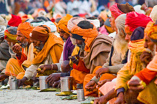 hindu pilgrims eating holy prasad - kumbh mela 2013 (india), ashram, bhagwa, crowd, dinner, eating, food, hindu pilgrimage, hinduism, holy prasad, kumbh mela, men, pilgrims, rows, saffron color, sitting