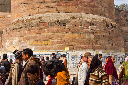 hindu pilgrims near base of tower of allahabad fort - kumbh mela 2013, allahabad fort, defensive wall, fortifications, fortress, hindu pilgrimage, hinduism, kumbh mela, masonry, men, paush purnima, pilgrims, rampart, tower, walking