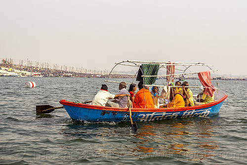 hindu pilgrims on row boat on the ganges river at sangam - kumbh mela (india), ganga, ganges river, hindu pilgrimage, hinduism, india, maha kumbh mela, paush purnima, pilgrims, river boats, rowing boat, small boat, triveni sangam