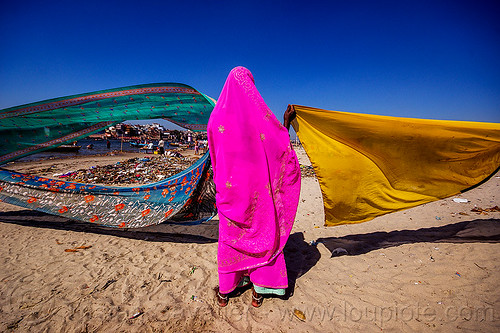 hindu woman drying saris in the wind - varanasi (india), beach, drying, india, river bank, sand, saree, sari, varanasi, wind, woman