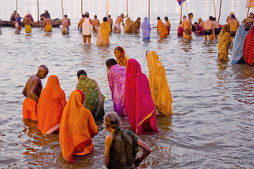 hindu women bathing in the ganges river, kumbh mela 2013, india