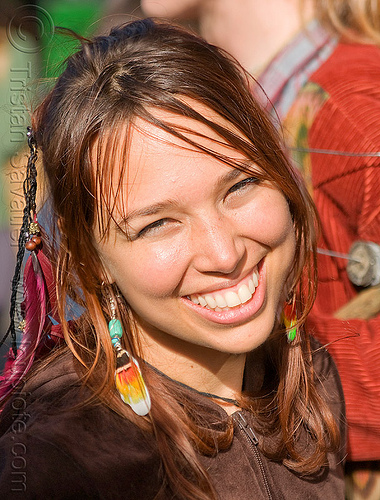 hippie girl with feathers, feather earrings, feather hair extensions, feathers, haight st, haight street fair, hippie, woman