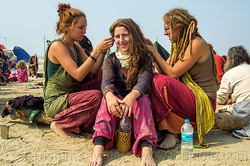 hippie girls making dreadlocks hair, hindu pilgrimage, hinduism, hippie, kumbh mela, rainbow camp, sitting, woman