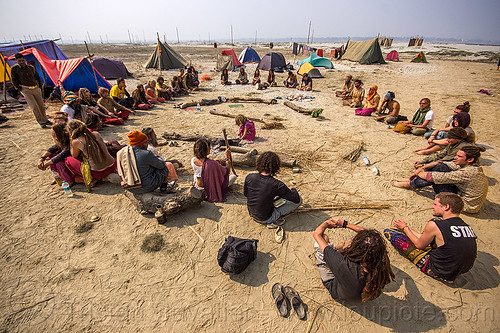 hippies sitting in circle at rainbow camp - kumbh mela 2013, camp fire, camping, circle, crowd, hindu pilgrimage, hinduism, hippie, india, maha kumbh mela, rainbow camp, sitting, tents