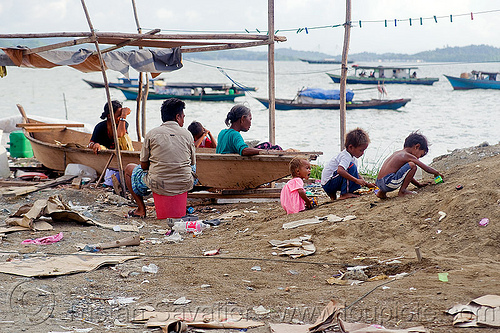 homeless living on boats, borneo, chid, children, encampment, garbage, homeless camp, kids, lahad datu, malaysia, ocean, poor, sea, seashore, small boats, trash, wasteland