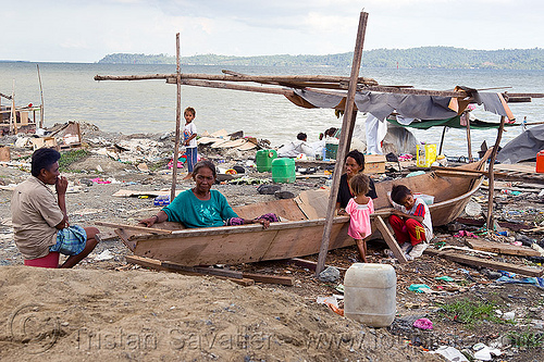 homeless living on boats, boats, borneo, chid, children, encampment, garbage, homeless camp, kids, lahad datu, malaysia, ocean, poor, sea, seashore, small boat, trash, wasteland