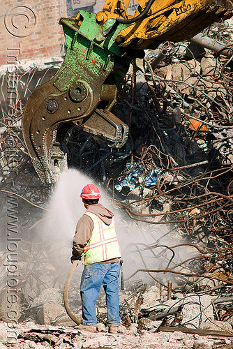 hydraulic crusher jaws - worker - building demolition, at work, attachment, building demolition, crusher jaws, hydraulic crusher, presidio hospital, presidio landmark apartments, spraying water, water spray, working