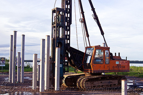 hydraulic pile driver, at work, beluran, borneo, building construction, building foundations, columns, foundation works, groundwork construction, hydraulic hammer, malaysia, pile driver, pile driving, precast concrete piles, reinforced concrete, working