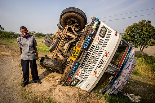 indian truck driver - overturned truck - tata motors (india), crash, ditch, lorry, man, overturned, road, rollover, tata motors, traffic accident, truck accident, truck driver, trucker, twisted, up-side-down, west bengal, wreck