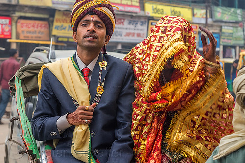 indian wedding - proud groom holding his covered bride like a trophy, bindi, bride, dressed-up, groom, hand mehndi, headdress, indian wedding, indian woman, man, scarf, suit, tilak, tilaka, traditional, turban, varanasi