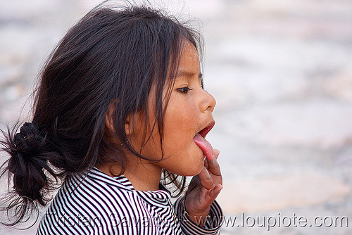 indigenous little girl (argentina), argentina, child, indigenous, iruya, kid, little girl, noroeste argentino, playing, quebrada de humahuaca, quechua, sticking out tongue, sticking tongue out