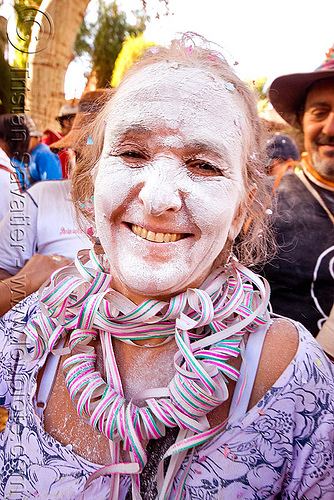 indigenous woman with white talk powder and serpentine throws - carnaval de tilcara (argentina), andean carnival, argentina, carnaval de la quebrada, carnaval de tilcara, confettis, noroeste argentino, quebrada de humahuaca, serpentine throws, talk powder, woman