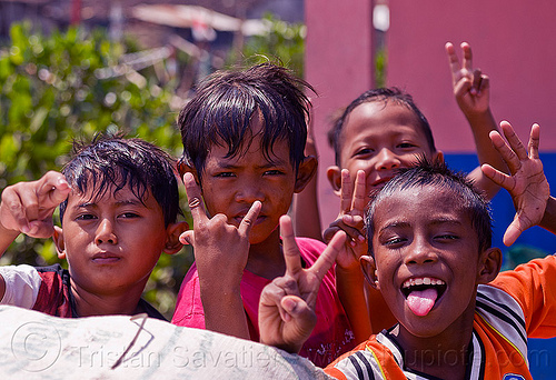 indonesian boys fooling around, boys, children, fingers, goofing, hand signs, hands, indonesia, kids, playing, sticking out tongue, sticking tongue out, tamansari