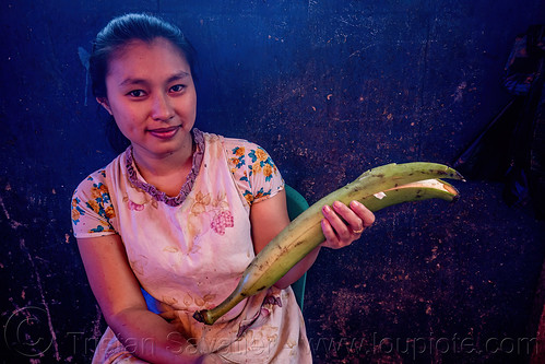 indonesian woman holding large green banana, banana, tana toraja, woman