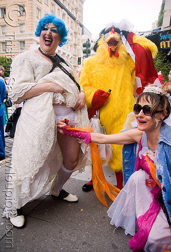 it's a boy! - man in drag getting check-out by a woman - brides of march (san francisco), blue hair, blue wig, bride, brides of march, chicken costume, man, palpation, wedding, white