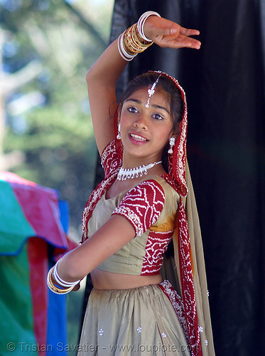 Premium AI Image | Young girl radiates youth and heritage in a bright  lehenga choli her laughter a testament to her jo