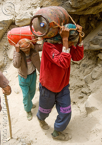 kashmiri load bearers carrying heavy propane tanks on trail - amarnath yatra (pilgrimage) - kashmir, amarnath yatra, gas tanks, hindu pilgrimage, kashmir, load bearers, loads, mountain trail, mountains, muslim, propane, supplies, wallahs