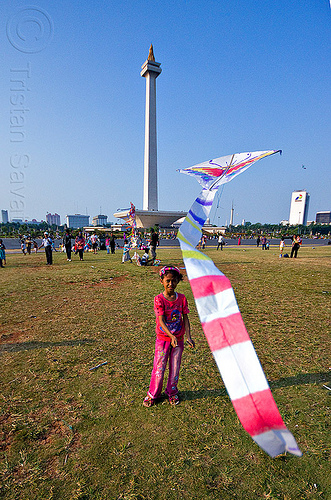 kid flying a kite near the national monument (monas) in jakarta, architecture, child, column, eid ul-fitr, flying, jakarta, kid, kite, lawn, medan merdeka, merdeka square, monumen nasional, national monument, park