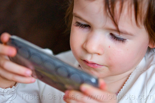 kid playing game on iphone, cellphone, child, iphone, kid, little girl, playing, video game