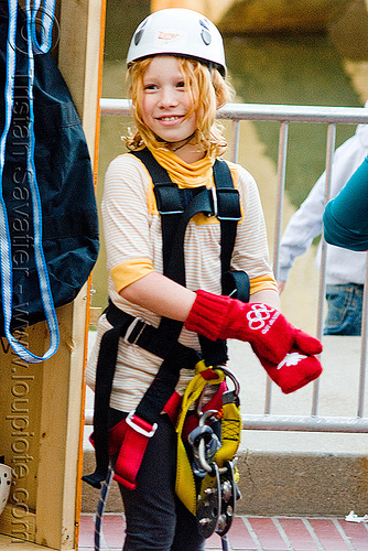 kid with climbing harness - zip-line over san francisco, adventure, child, climbing helmet, embarcadero, gloves, kid, little girl, mountaineering, redhead, trolley, urban, zip line, zip wire