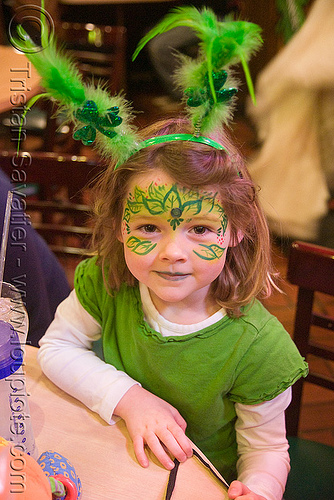 kid with green face paint - st patrick's day (san francisco), child, face painting, facepaint, kid, little girl, rabbit ears, st paddy's day, st patrick's day