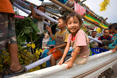kids in pickup truck - parading the giant bamboo fireworks rocket - vang vieng (laos), bamboo rocket, child, fireworks, kid, parade, pyrotechnics, vang vieng