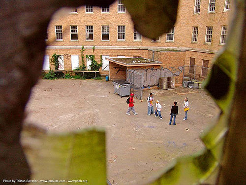 kids-playing - courtyard - broken window - abandoned hospital (presidio, san francisco), abandoned building, abandoned hospital, child, graffiti, kid, presidio hospital, presidio landmark apartments, trespassing, window