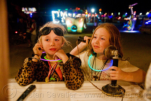 kids playing with telephone on "the front porch" art car - burning man 2009, boy, burning man, children, kids, little girl, night, old, phone, telephone, the front porch