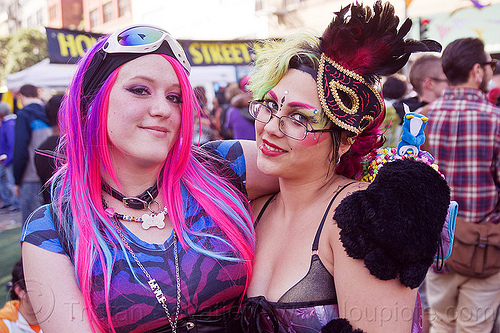 kit ten and emma, carnival mask, emma, feather headdress, goggles, kit ten, pink hair, woman