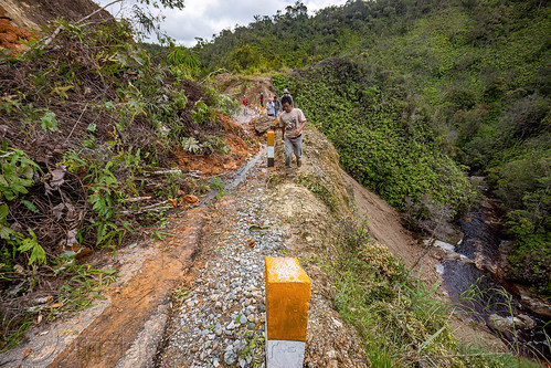 landslide completely blocking small mountain road, bada valley road landslide, men, mountain road, road to bada valley