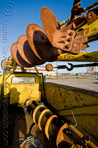 large ground drills on utility truck, drills, ground drill, junkyard, lorry, muni, no trespassing, san francisco municipal railway, utility truck, yellow