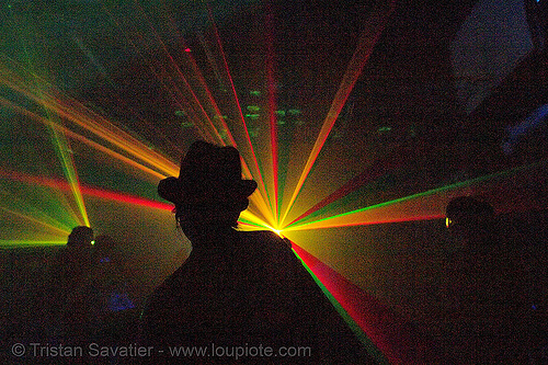 laser and shadows in warehouse underground rave party, backlight, laser lightshow, laser show, lasers, nightclub, nightlife, rave lights, ravers, silhouettes
