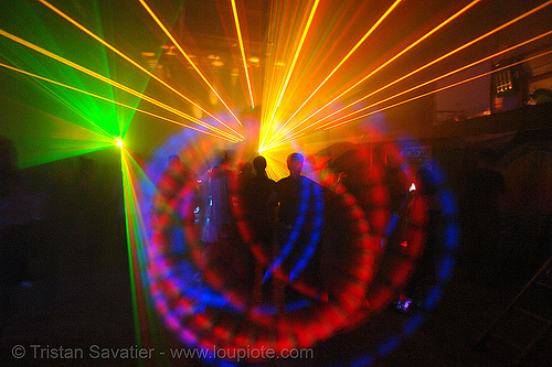 laser show - spinning lights and shadows in warehouse underground rave party, backlight, glowing, laser lightshow, laser show, lasers, led lights, night, nightclub, nightlife, rave lights, ravers, silhouettes