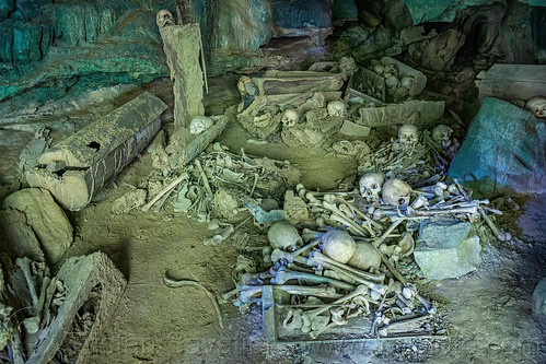 latea burial cave - scattered human bones and skulls and old coffins, burial site, cemetery, coffins, graveyard, gua latea, human bones, human skulls, latea burial caves, latea cave, skeletons
