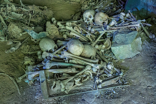 latea cave burial site - scattered human bones and skulls, burial site, cemetery, coffins, graveyard, gua latea, human bones, human skulls, latea burial caves, latea cave, skeletons