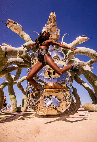 layla jumping in front of medusa - burning man 2015, art installation, burning man, head, jump, jumpshot, kevin clark, medusa madness, sculpture, snakes, steel, woman