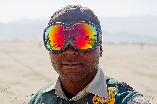 LEO with mirror goggles - burning man 2013, burning man, cop, law enforcement, leo, mirror goggles, police, rainbow colors, robot heart goggles