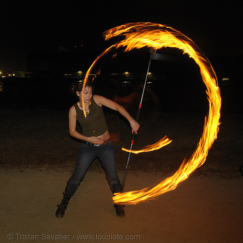 lexie spinning a fire staff