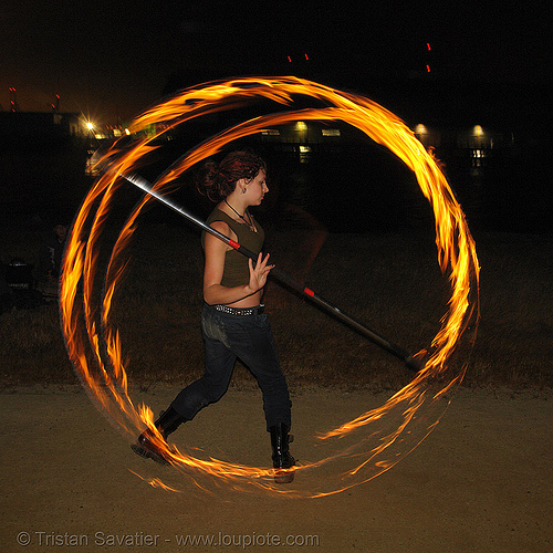 lexie spinning a fire staff, circle, fire dancer, fire dancing, fire performer, fire spinning, fire staff, lexie, night, ring, spinning fire
