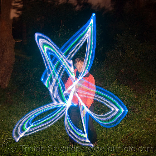 light painting - me, drawing a star with LED lights, full moon party, glowing, golden gate park, led lights, led staff, light drawing, light graffiti, light painting, man, night