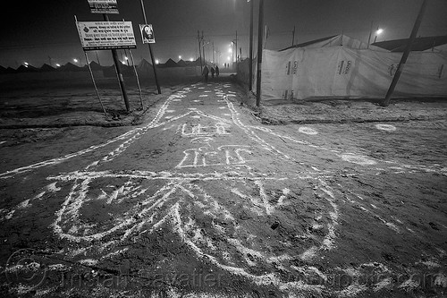 lime powder patterns and writings on the ground at kumbh mela (india), bleach powder, disinfection, drawings, hindu pilgrimage, hinduism, kumbh maha snan, kumbh mela, lime powder, mauni amavasya, night