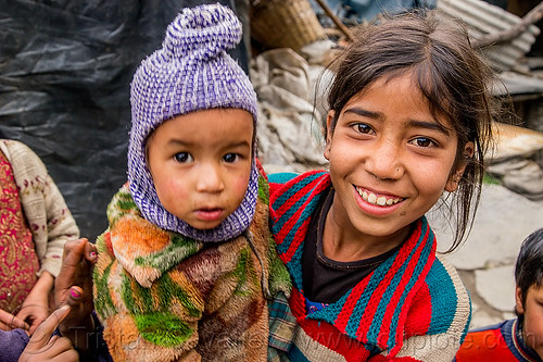 little girl holding baby (india), baby, children, janki chatti, kids, knit cap, little girl, toddler