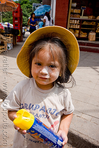 little girl holding party foam spray can - carnaval - carnival in jujuy capital (argentina), andean carnival, argentina, carnaval de la quebrada, child, hat, jujuy capital, kid, little girl, noroeste argentino, san salvador de jujuy, spray can