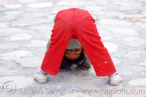 little girl playing (argentina), argentina, child, cobblestones, iruya, kid, little girl, noroeste argentino, playing, quebrada de humahuaca, quechua, upside-down